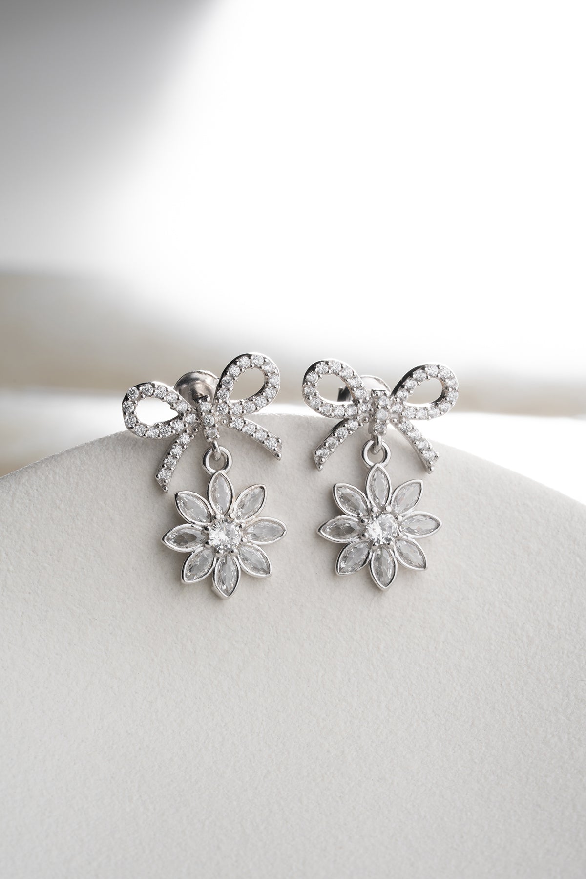 Bow and Flower Drop Earrings in Silver