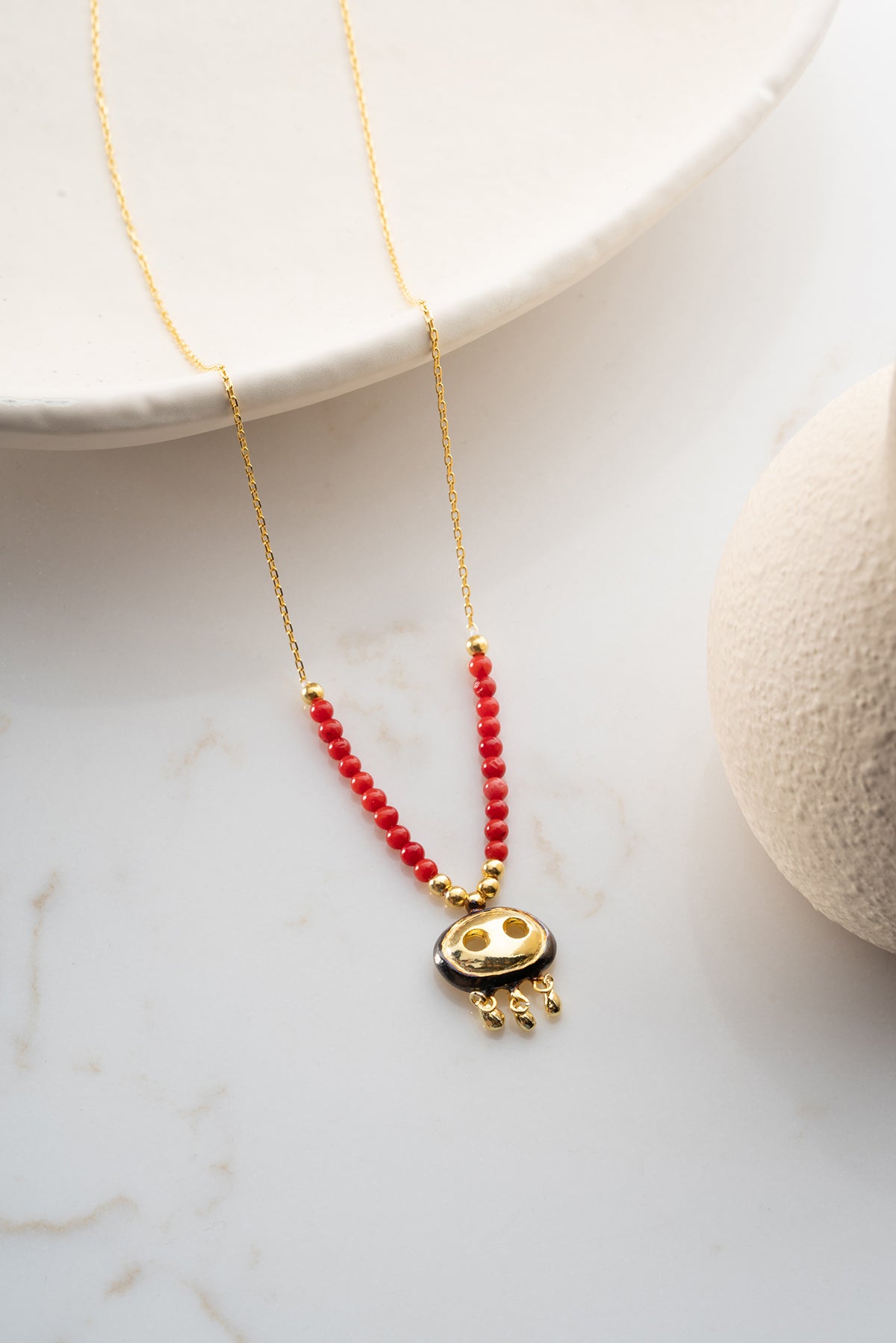 Red Beaded Necklace with Gold Fringe Charm