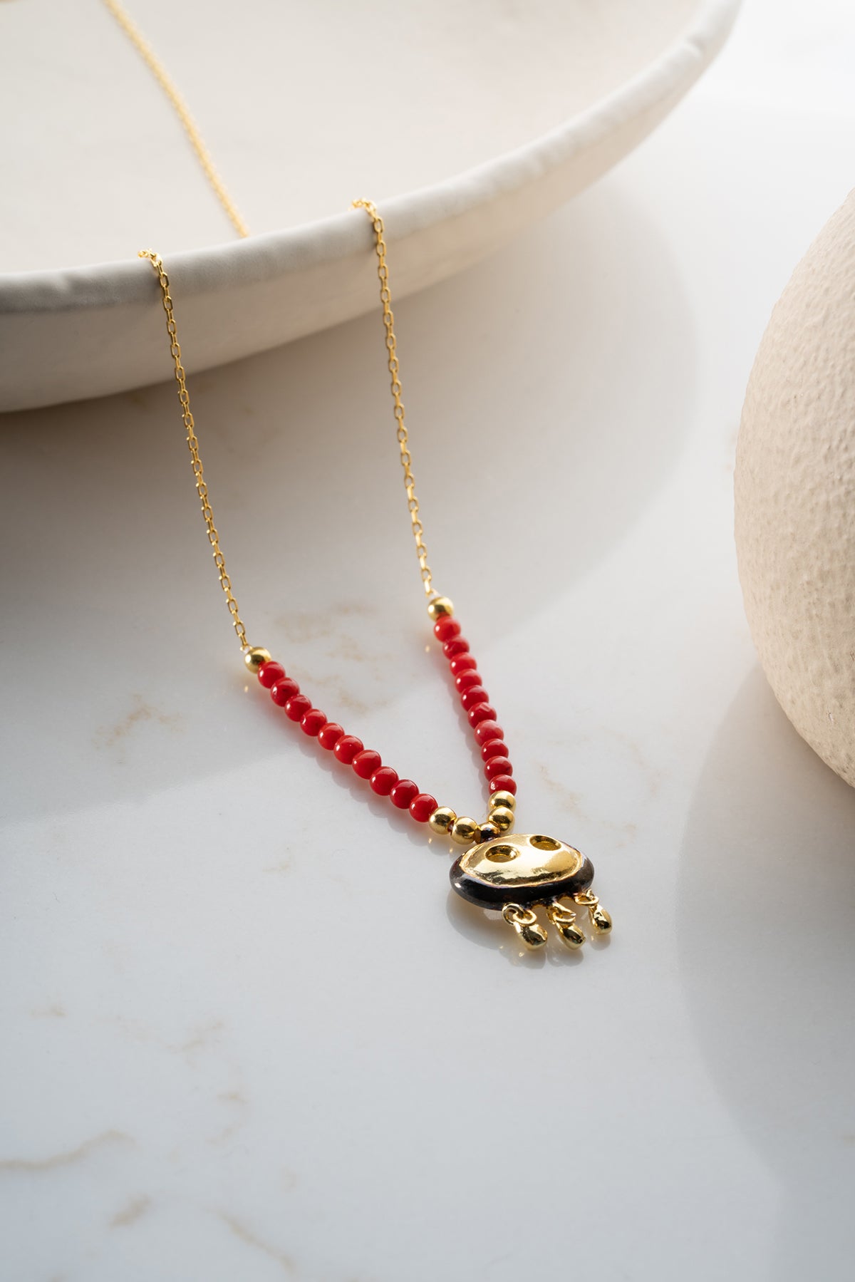 Red Beaded Necklace with Gold Fringe Charm