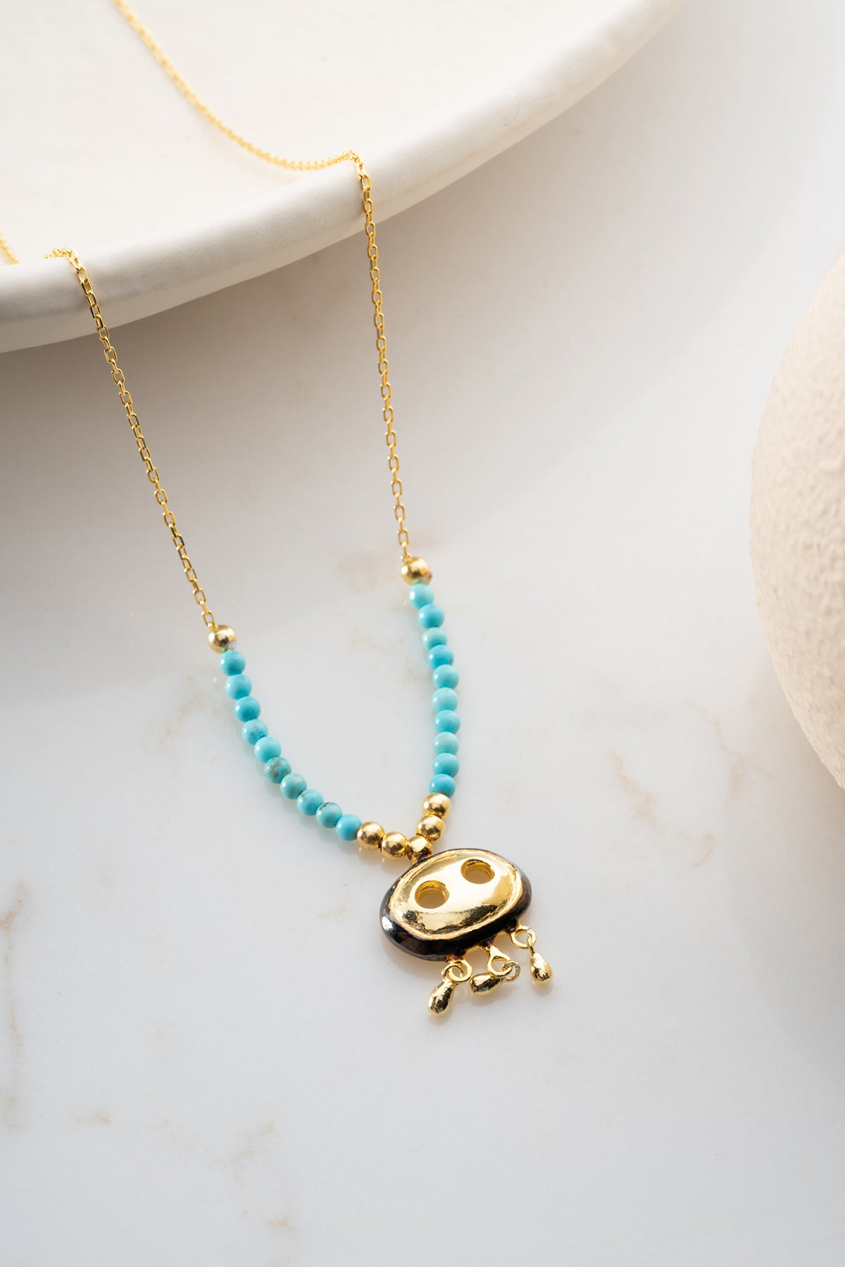 Turquoise Beaded Necklace with Gold Fringe Charm