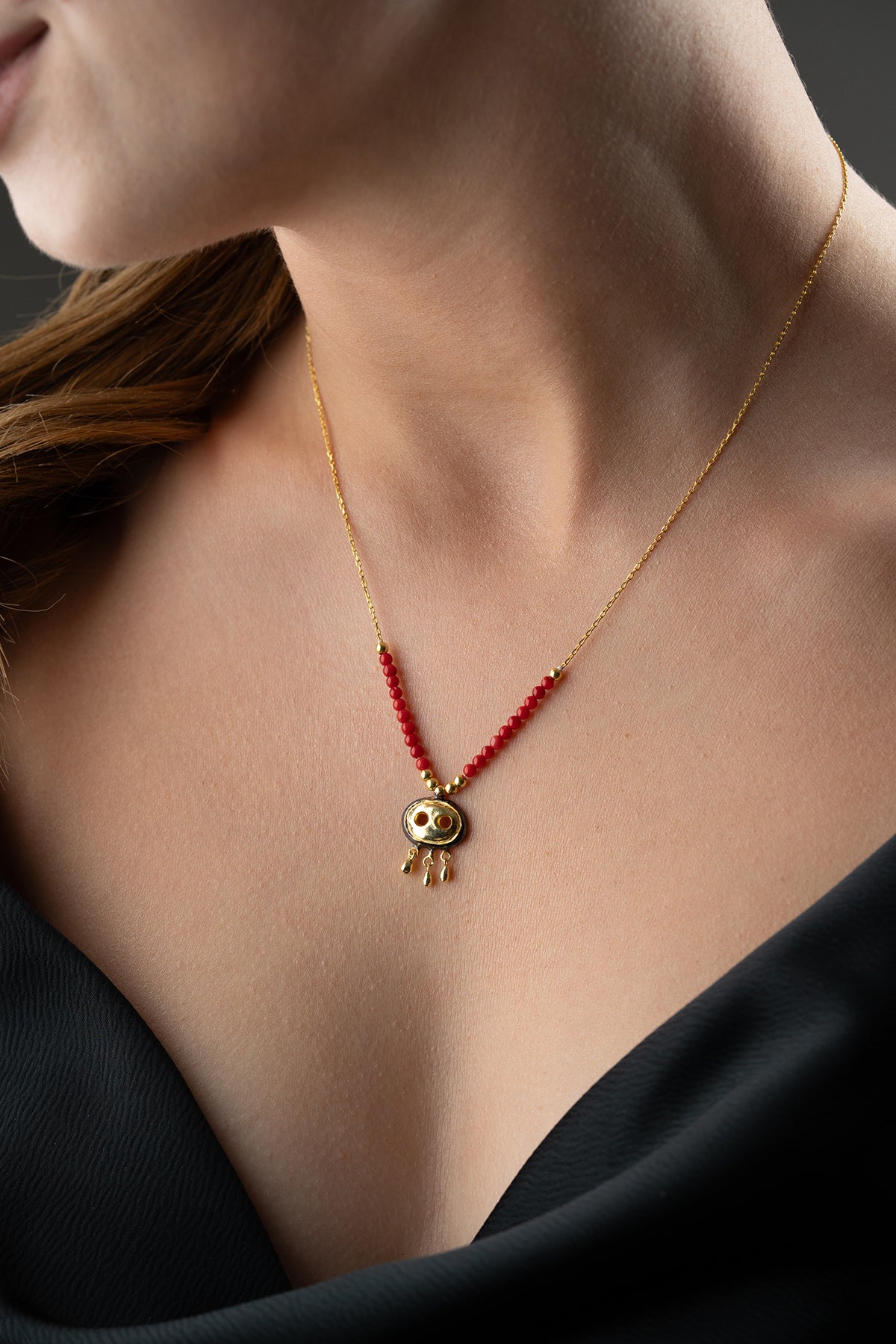 Red Beaded Necklace with Gold Fringe Charm