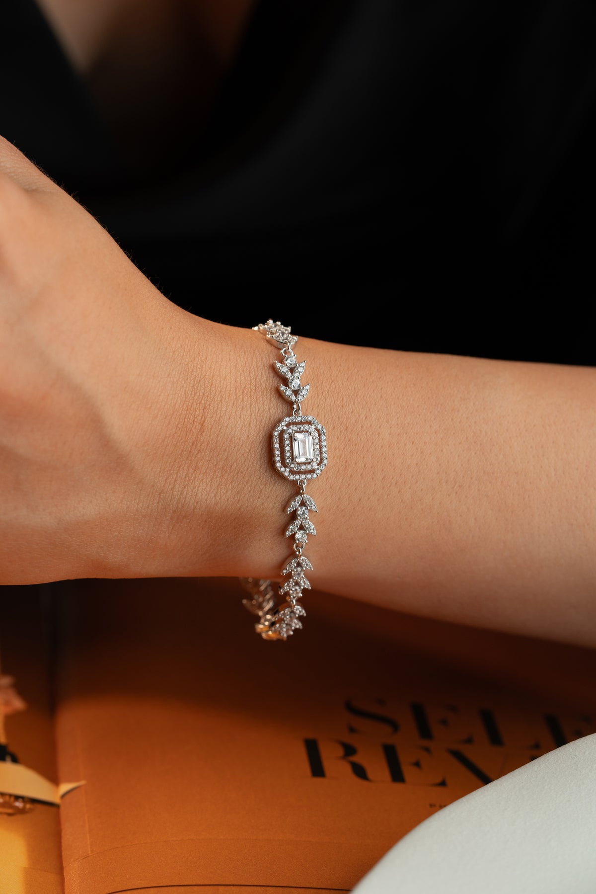 Leaf Vine Tennis Bracelet with Emerald Cut Halo