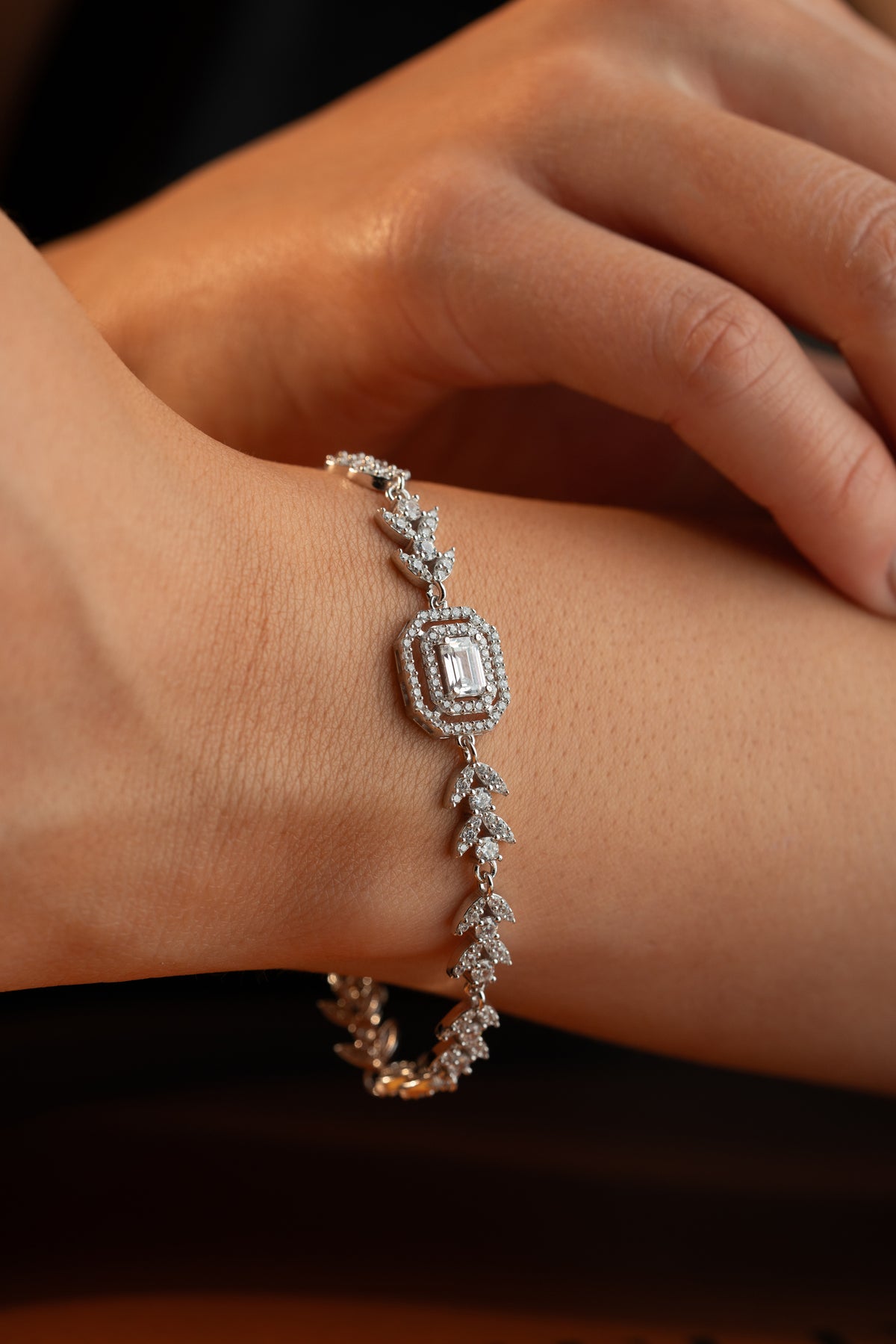 Leaf Vine Tennis Bracelet with Emerald Cut Halo