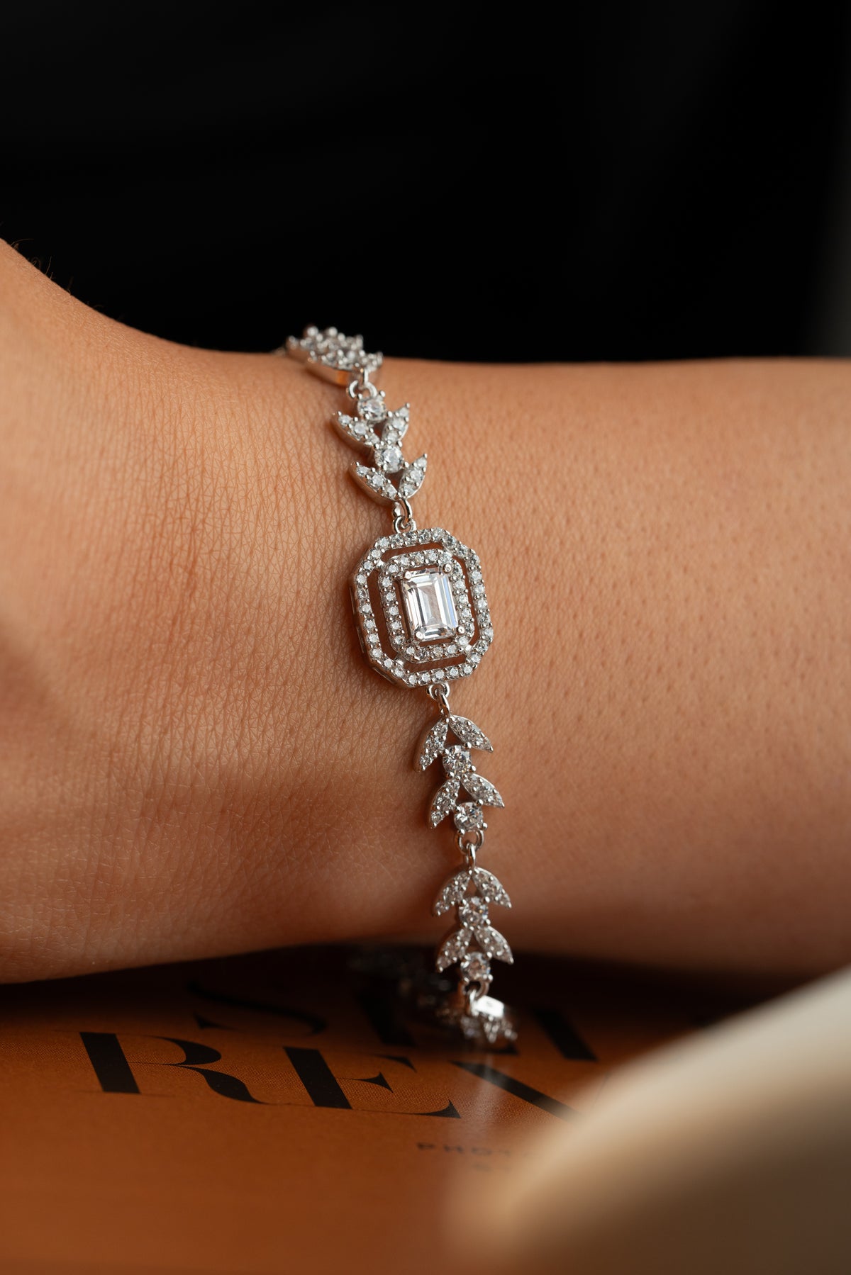 Leaf Vine Tennis Bracelet with Emerald Cut Halo