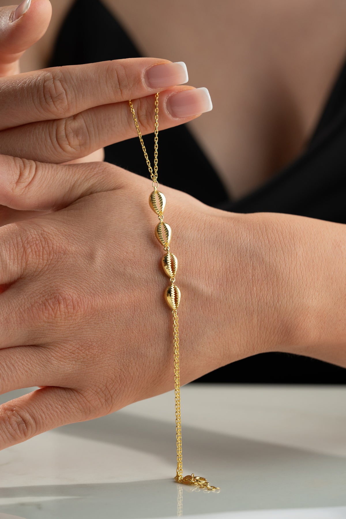 Cowrie Shell Hand Chain Bracelet in Gold