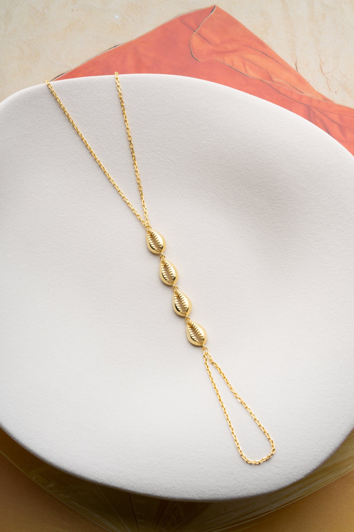 Cowrie Shell Hand Chain Bracelet in Gold