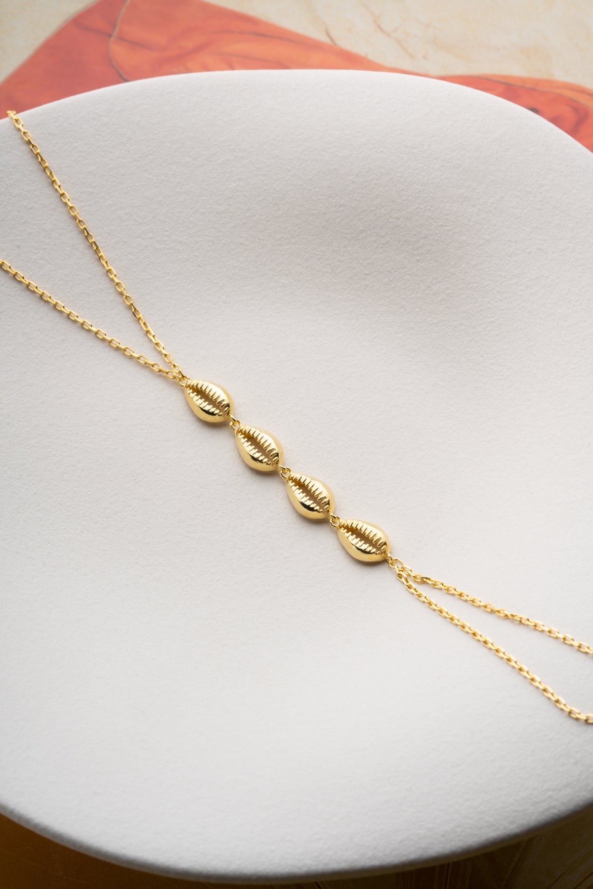 Cowrie Shell Hand Chain Bracelet in Gold