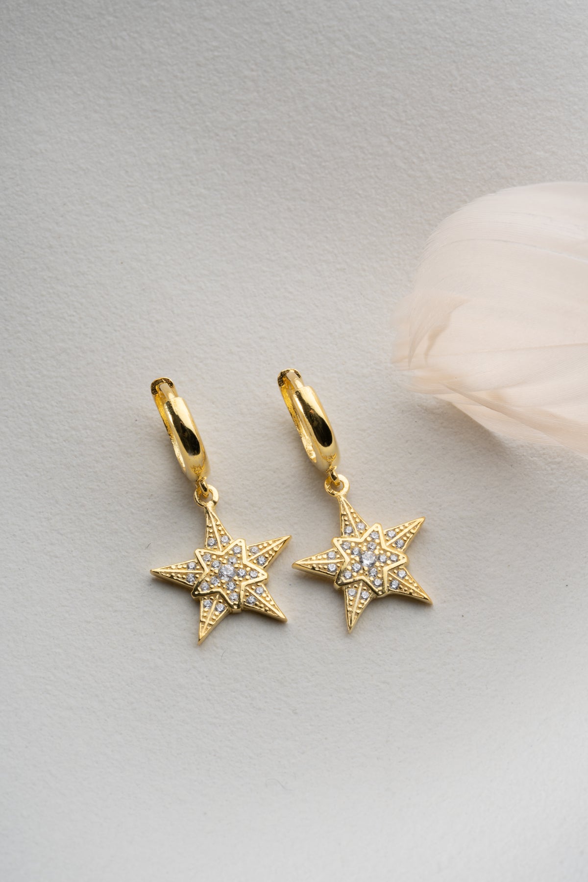 Pave Star Dangle Earrings in Gold