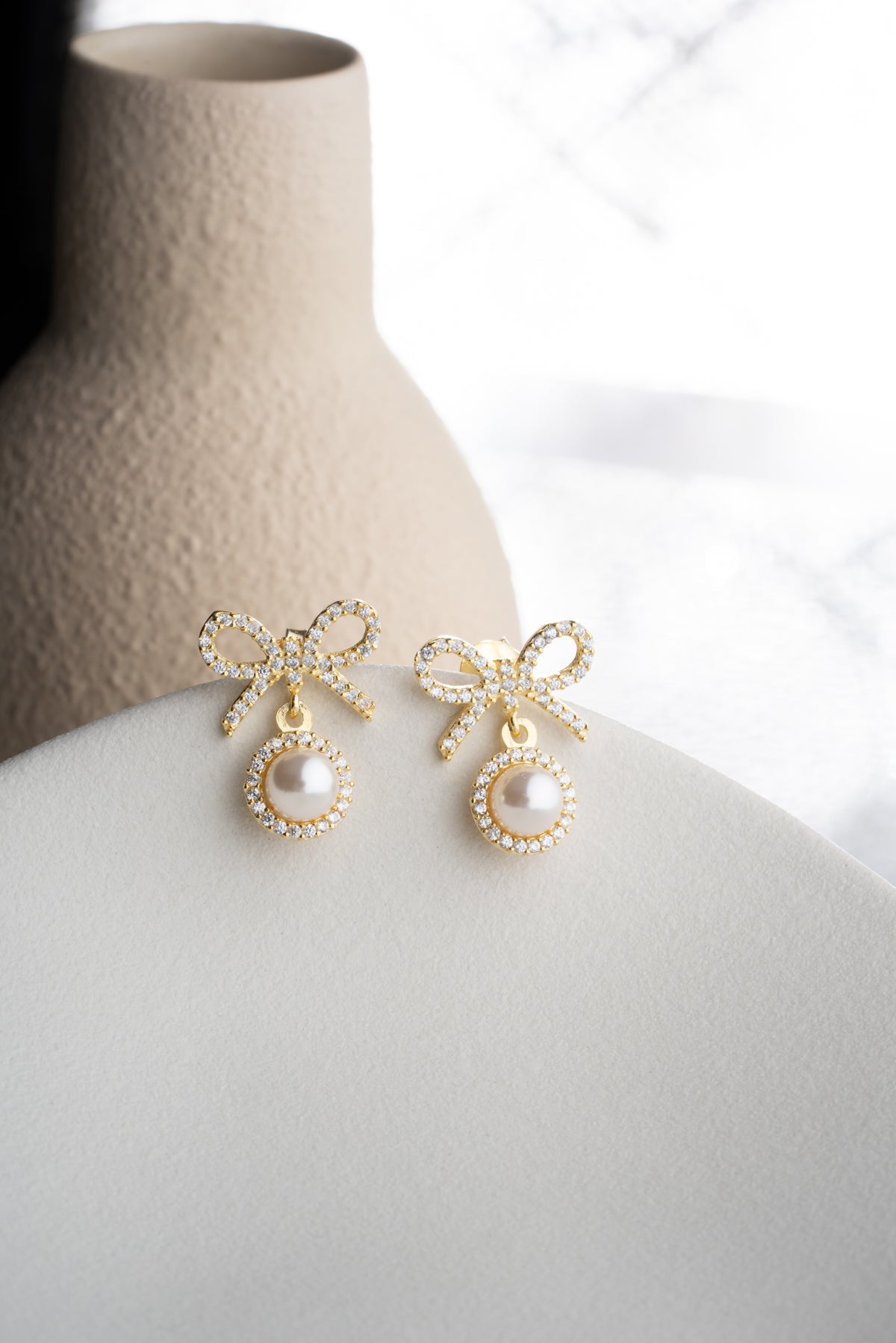 Pearl Bow Drop Earrings in Gold