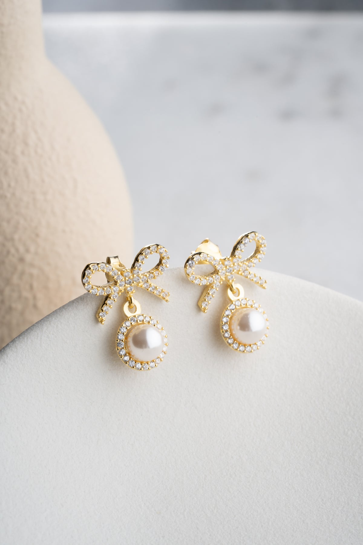 Pearl Bow Drop Earrings in Gold
