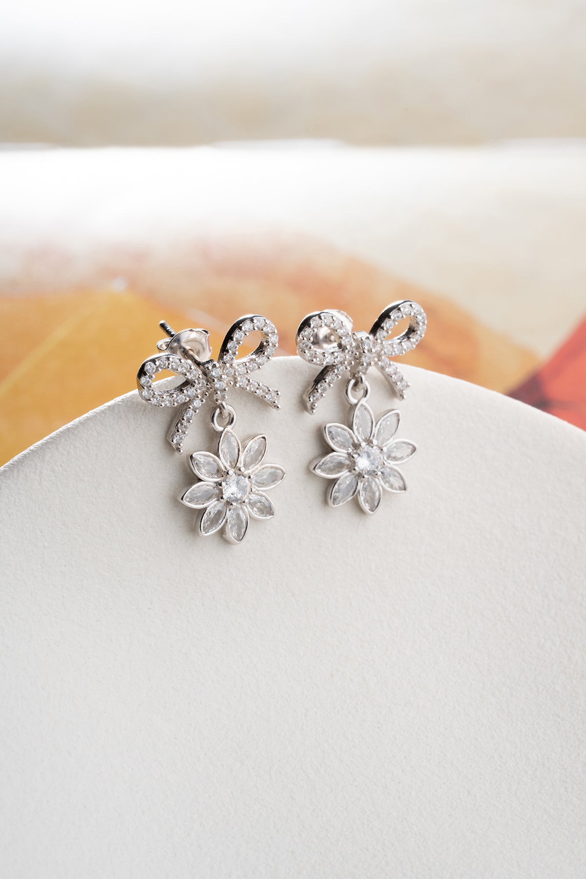 Bow and Flower Drop Earrings in Silver
