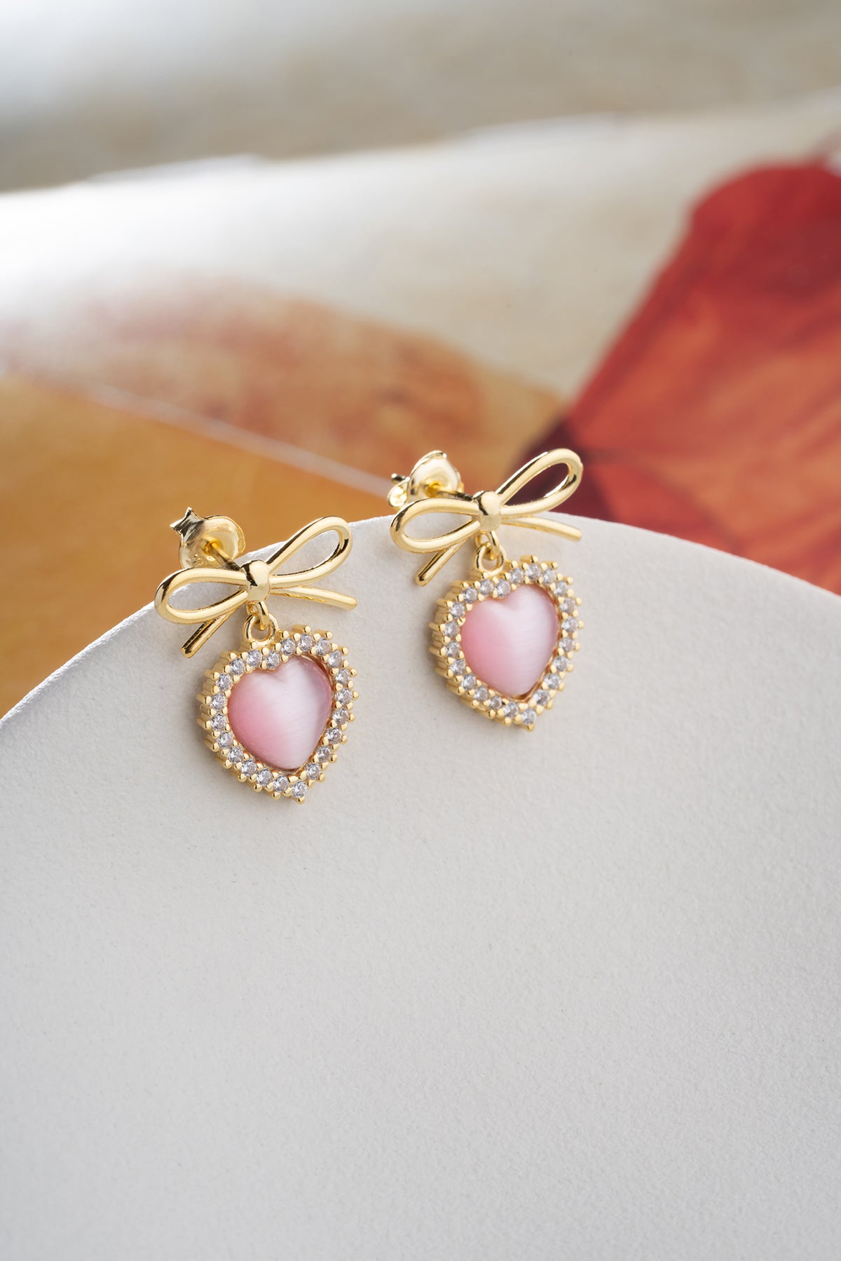 Bow and Heart Drop Earrings in Gold