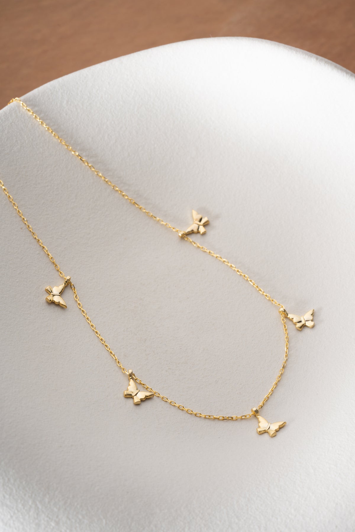 Butterfly Charm Station Necklace in Gold