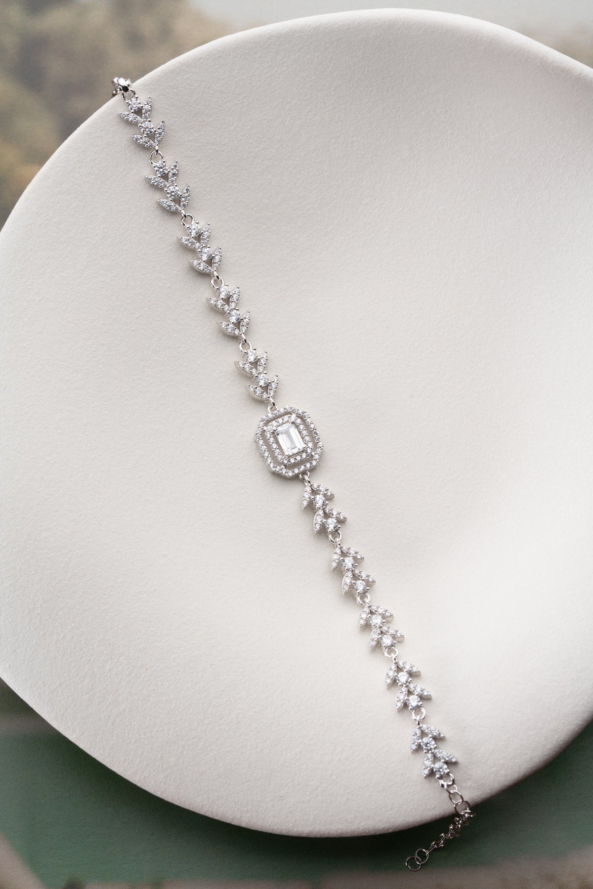Leaf Vine Tennis Bracelet with Emerald Cut Halo