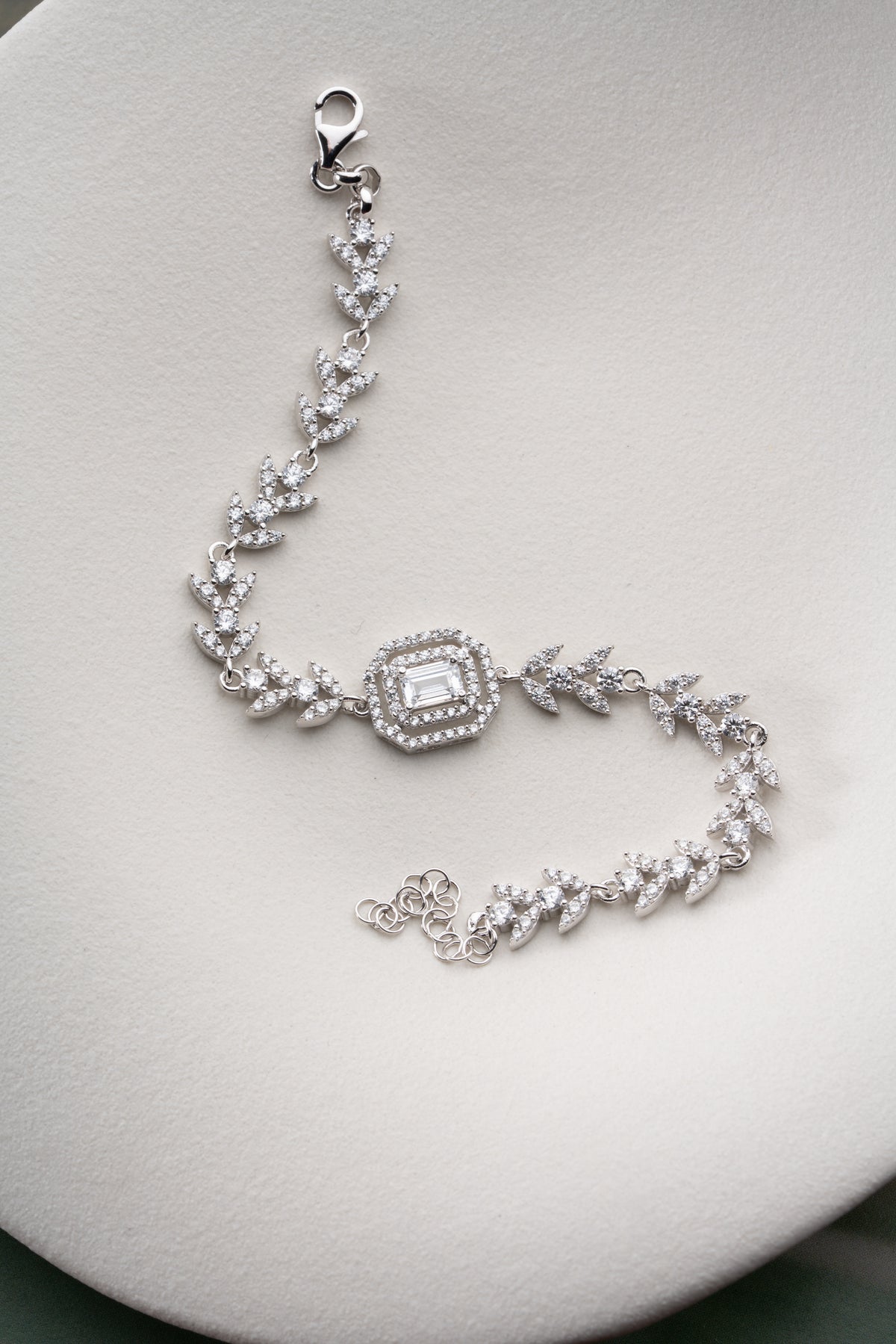 Leaf Vine Tennis Bracelet with Emerald Cut Halo