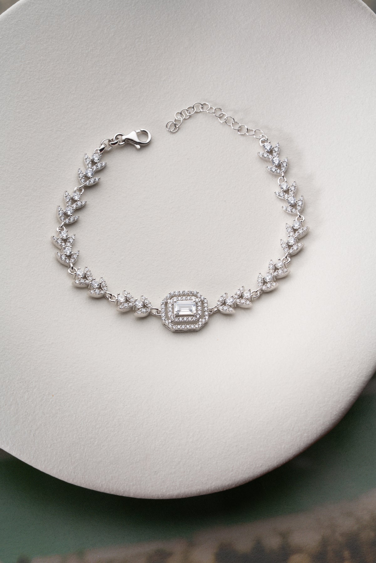 Leaf Vine Tennis Bracelet with Emerald Cut Halo