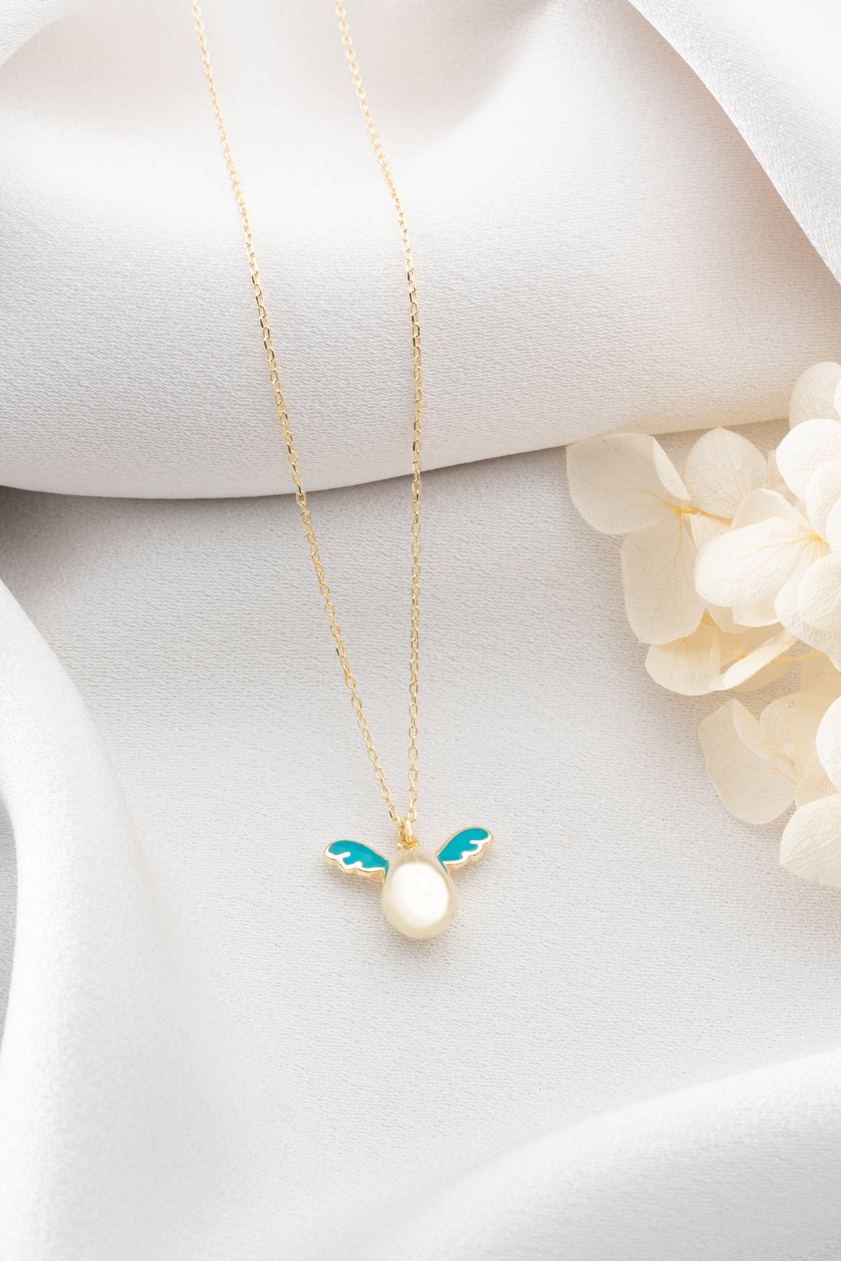 Pearl Egg Necklace with Turquoise Enamel Wings