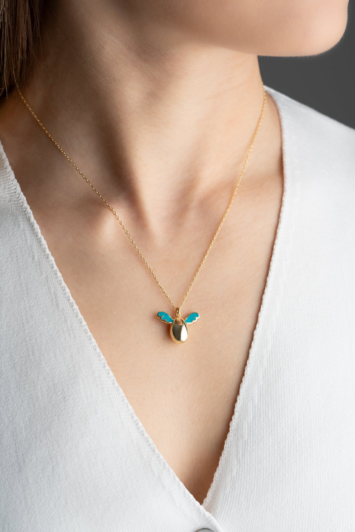 Pearl Egg Necklace with Turquoise Enamel Wings