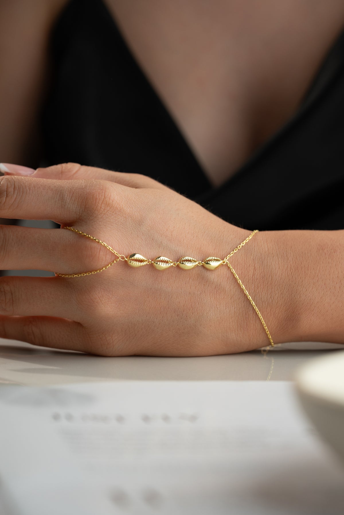 Cowrie Shell Hand Chain Bracelet in Gold